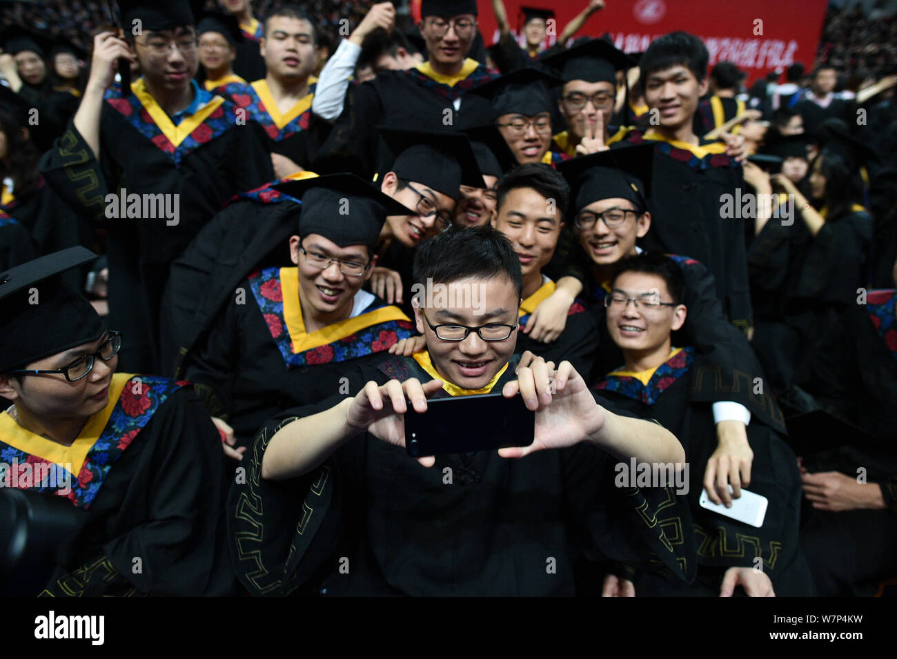 University undergraduates in gowns hi-res stock photography and images ...