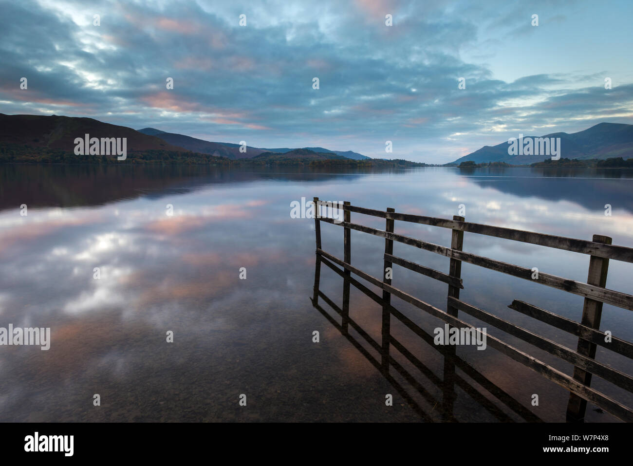 Derwent Water, fence with flooding at sunset, near Keswick, The Lake District, Cumbria, UK. October 2012. Stock Photo
