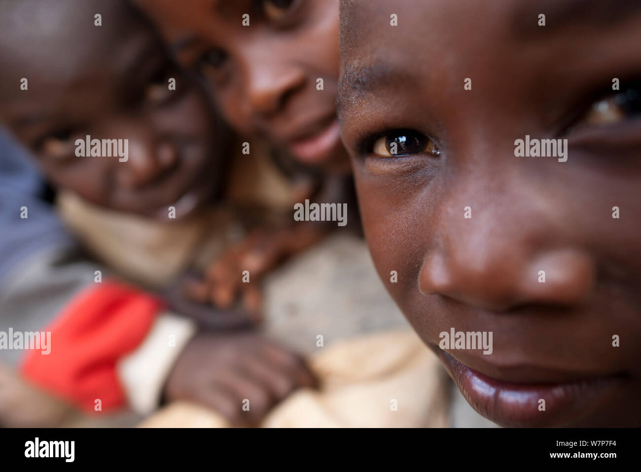 Mozambican children close up interested in camera. Pemba to Montepuez highway, north-eastern Mozambique, November 2011. Stock Photo
