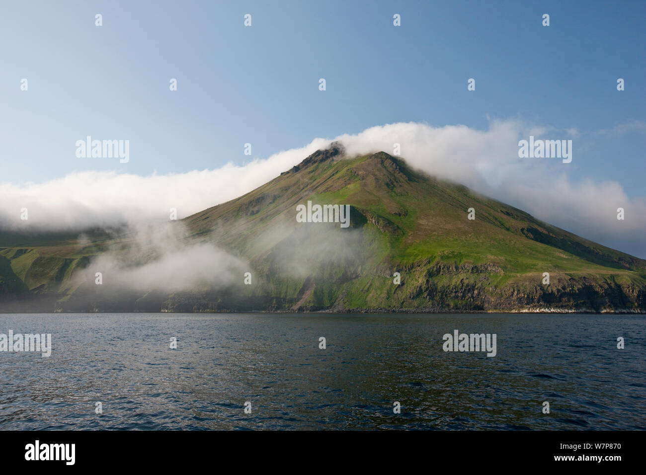 View of active volcano at Chirpoy Island, Kurils, Russian Far East. Chirpoy (meaning small bird) is the collective name usually given to the twin volcanic islands of Chirpoy and Brat Chirpoev (Russian for Chirpoy's Brother) June 2012 Stock Photo