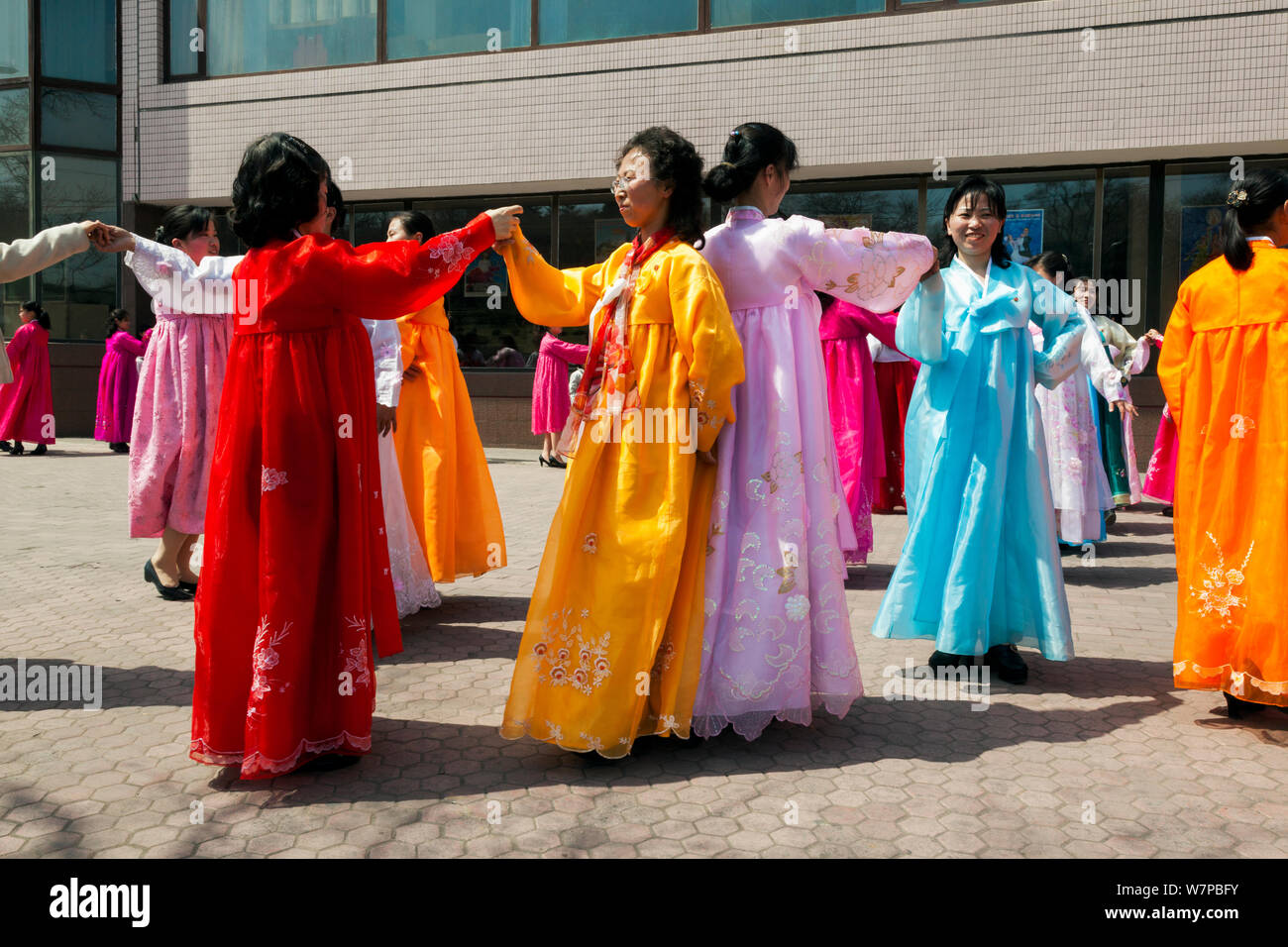 Women in traditional dress dancing during street celebrations on the 100th anniversary of the birth of President Kim IL Sung, Pyongyang, Democratic Peoples' Republic of Korea (DPRK), North Korea, April 15 2012 Stock Photo