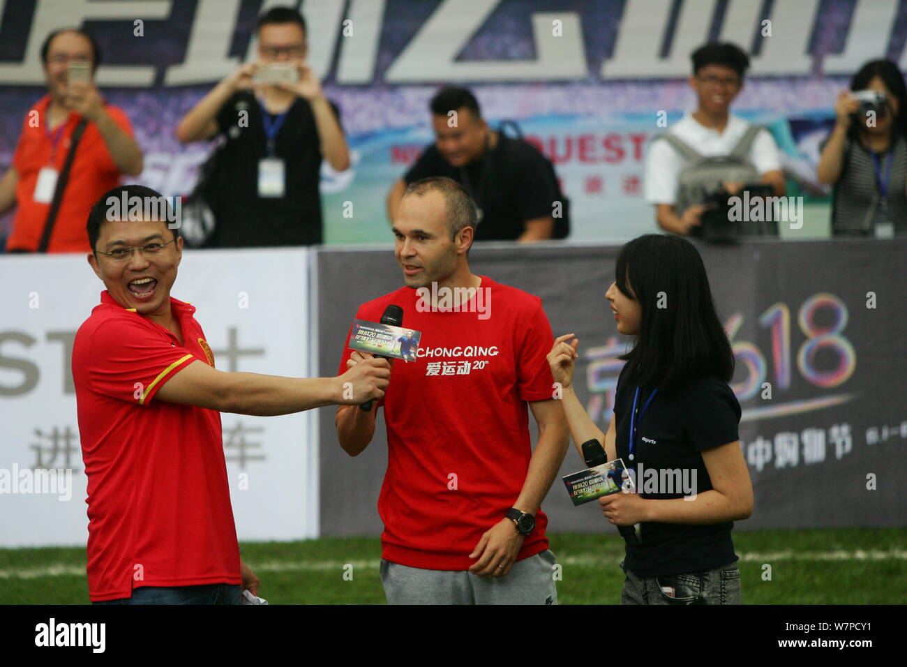 Spanish football player Andres Iniesta, center, attends a commercial event in Chongqing, China, 13 June 2017. Stock Photo