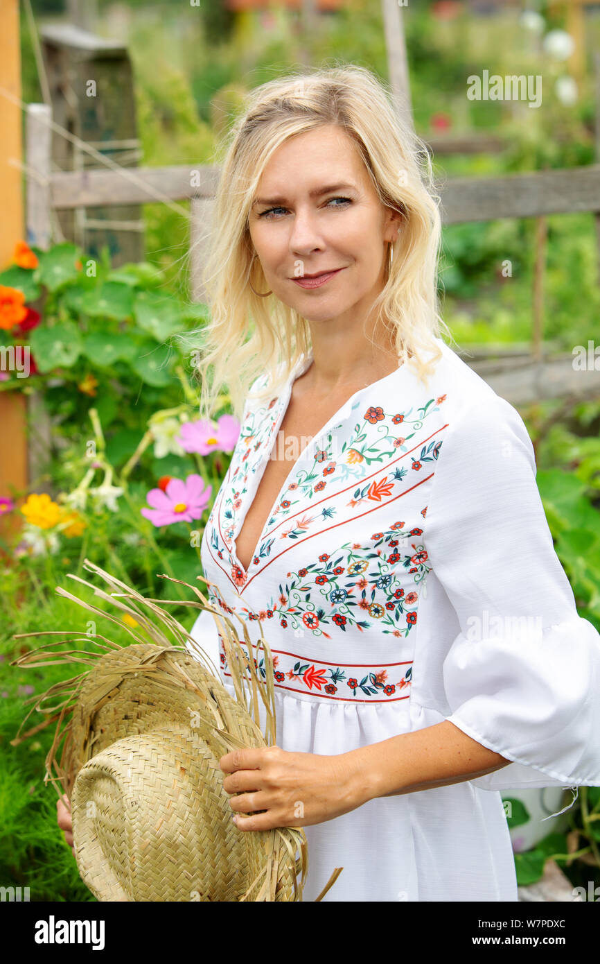 Blonde woman in white dress hi-res stock photography and images - Alamy