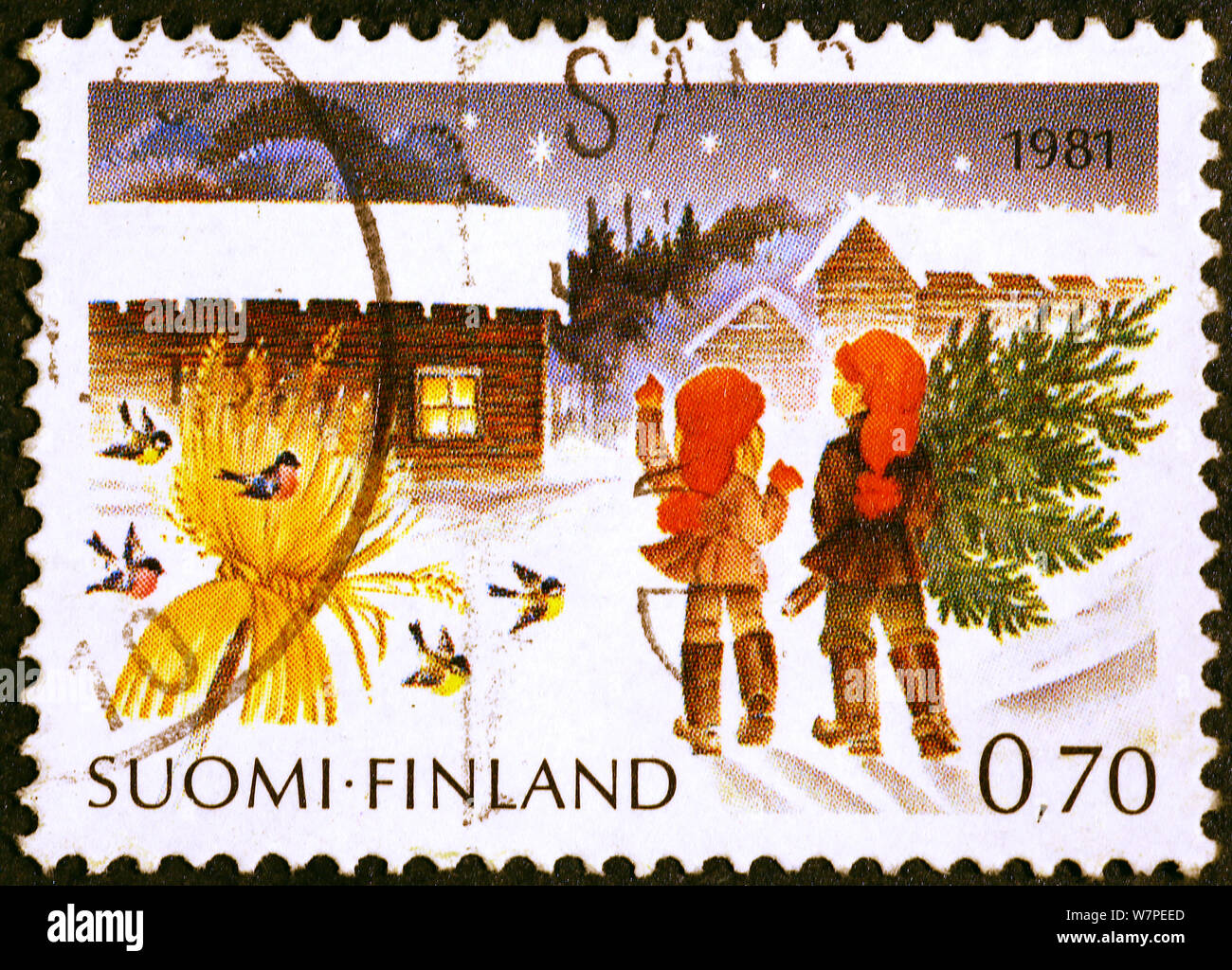 Gnomes with Christmas tree on finnish postage stamp Stock Photo