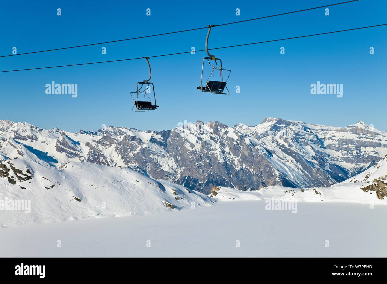 Chair lift above Four Valleys region, Valais, Verbier, Bernese Alps, Switzerland January 2009 Stock Photo