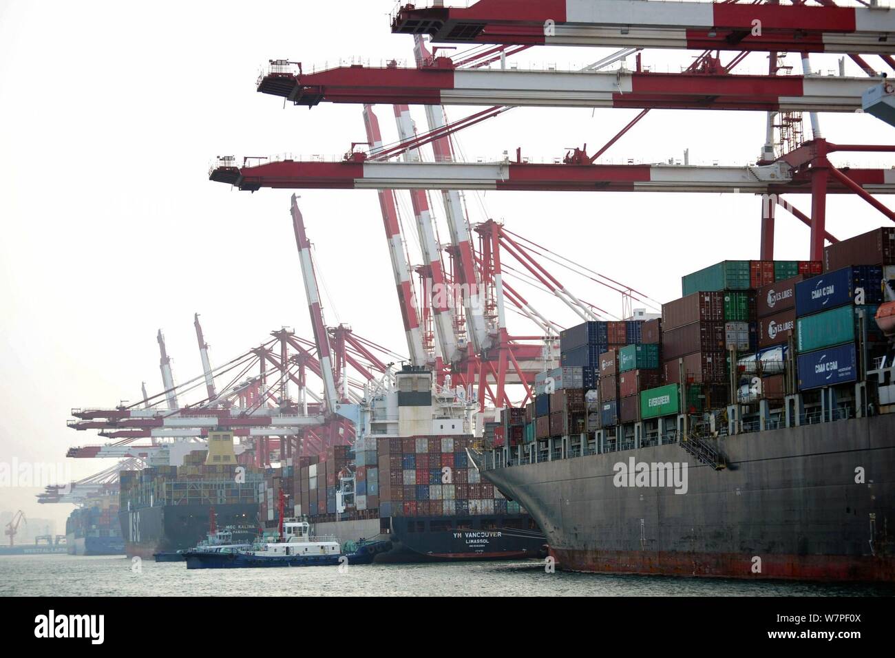 Cargo ships loaded with containers to be shipped abroad berth at the Port of Qingdao in Qingdao city, east China's Shandong province, 7 June 2017. Stock Photo