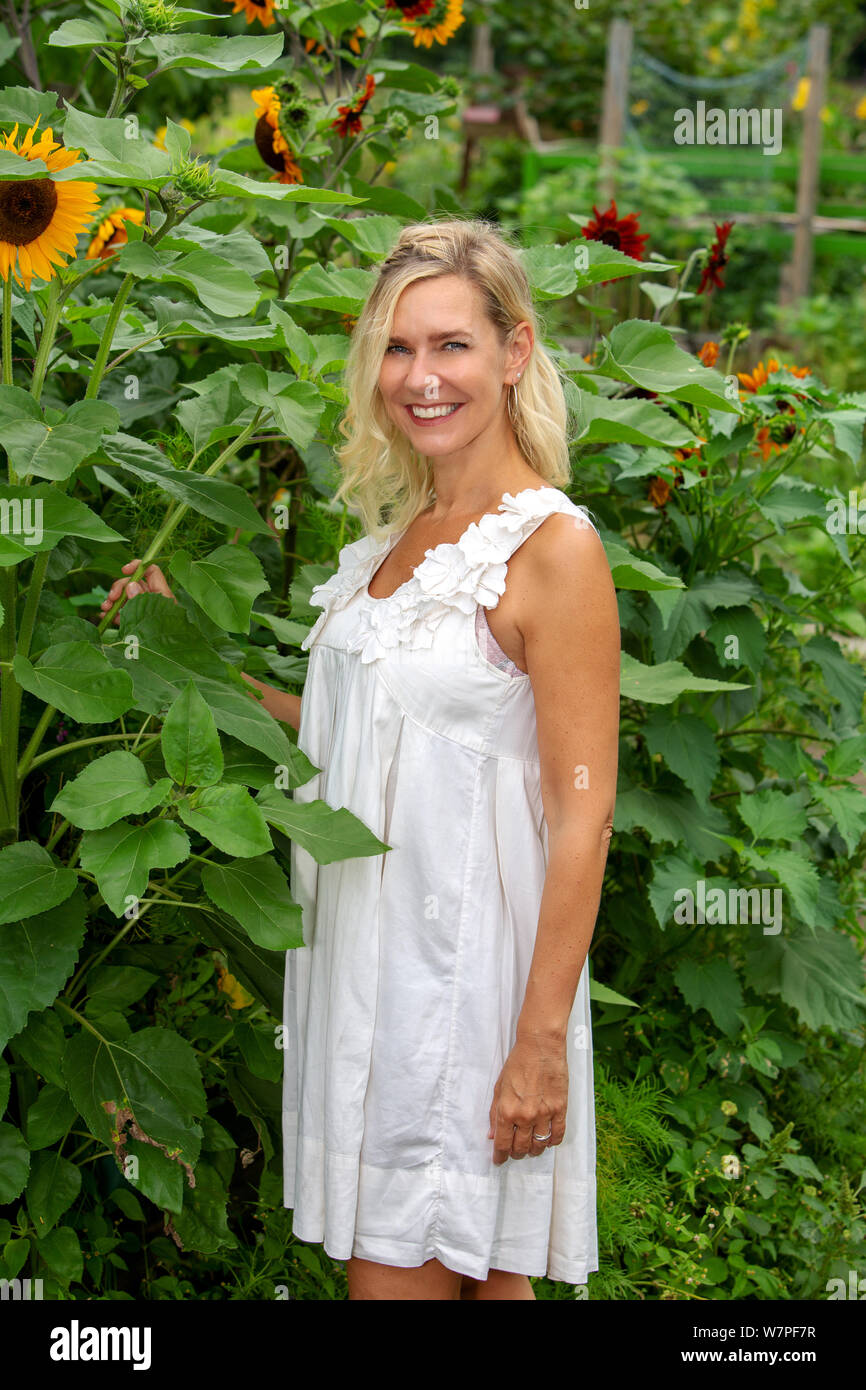 Blonde woman in white dress hi-res stock photography and images - Alamy