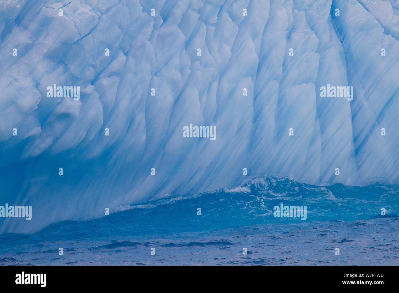 Waves breaking against eroded iceberg. Southern Ocean near Antarctica, November 2011. Stock Photo