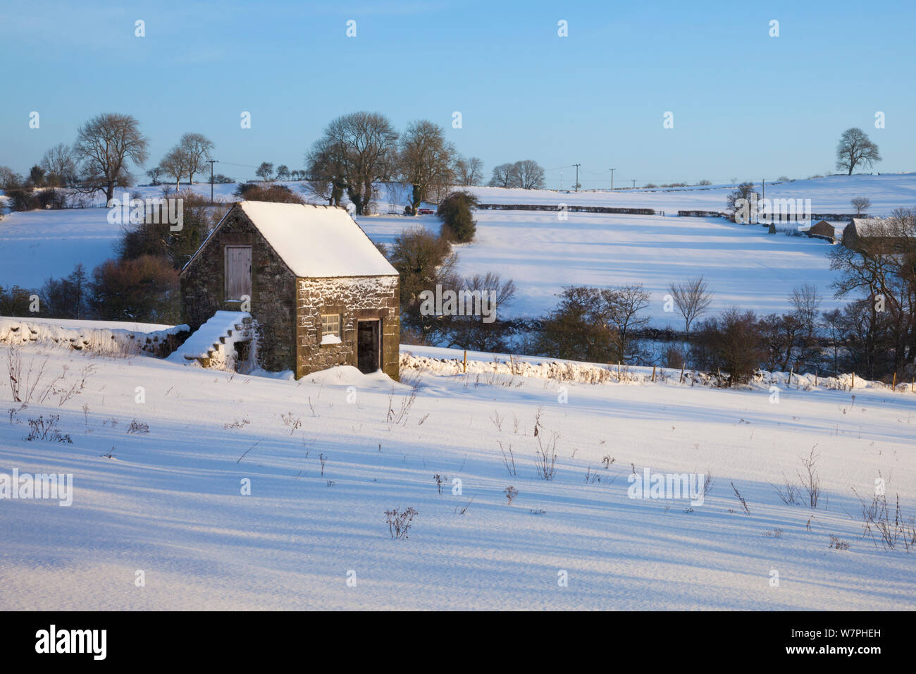 Stone barn after snowfall. Bonsall village, Derbyshire, Peak District. Stock Photo