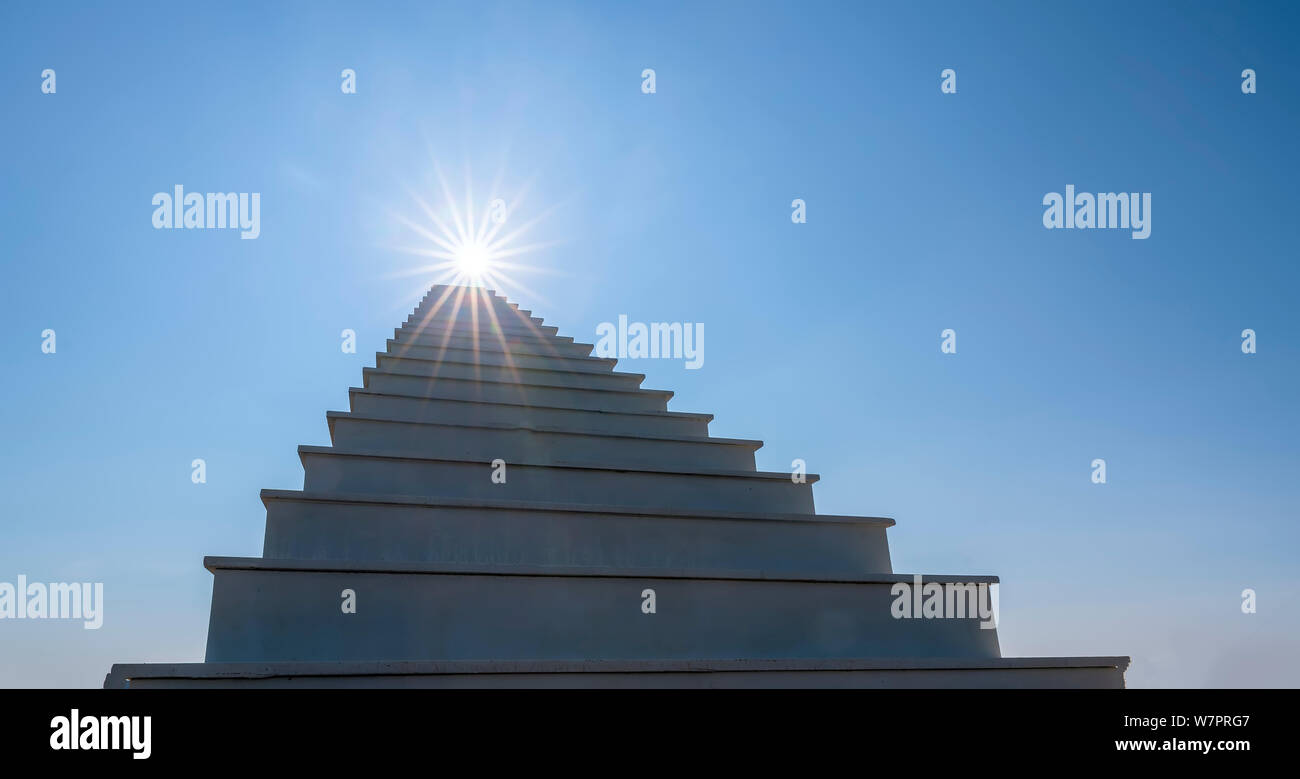 Ladder Paradise leading up to the sun. Development Motivation Business Career Heaven Growth Concept Stock Photo