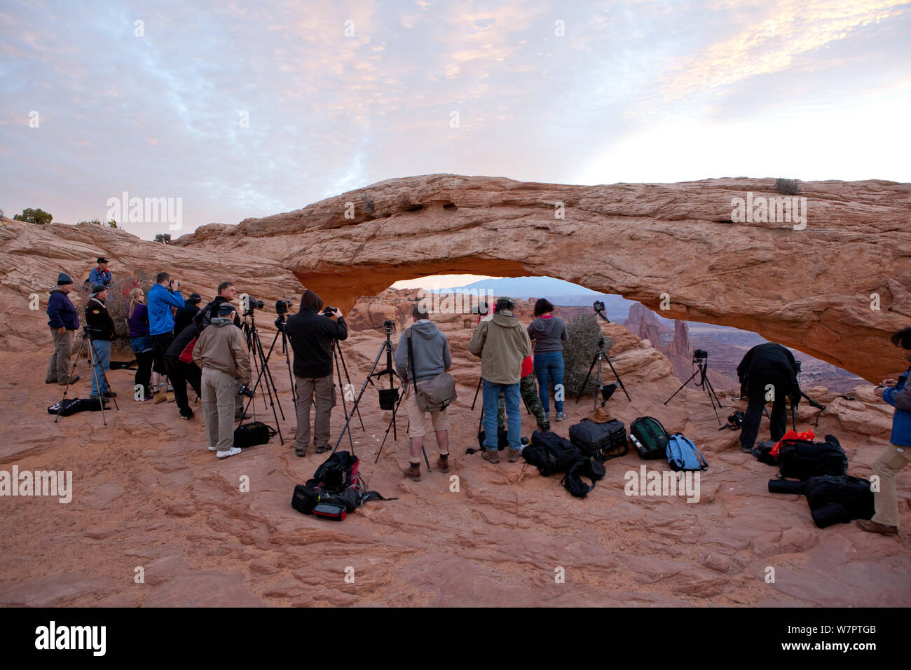 Photographers at Mesa Arch waiting for sunrise. Canyonlands National Park, Utah, October 2012. Stock Photo