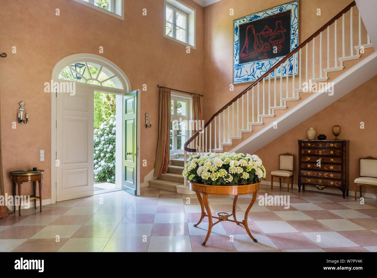 Flowers and modern art in entrance hall Stock Photo