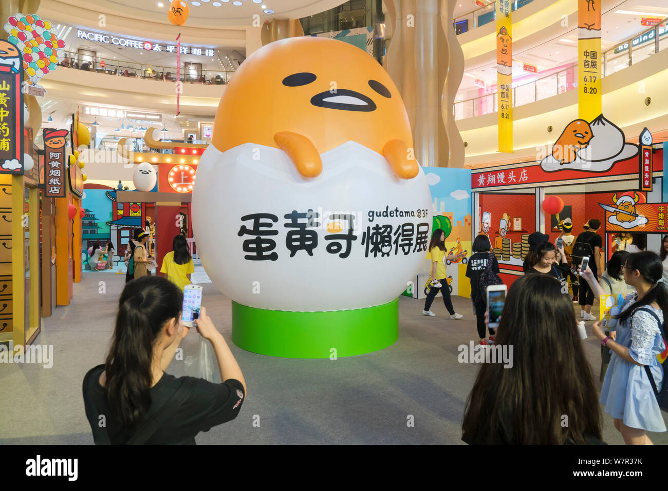 Cartoon enthusiasts take photos of Gudetama, or lazy egg, created by Hello Kitty's developer Sanrio, in Shanghai, China, 19 June 2017.   The Japanese Stock Photo