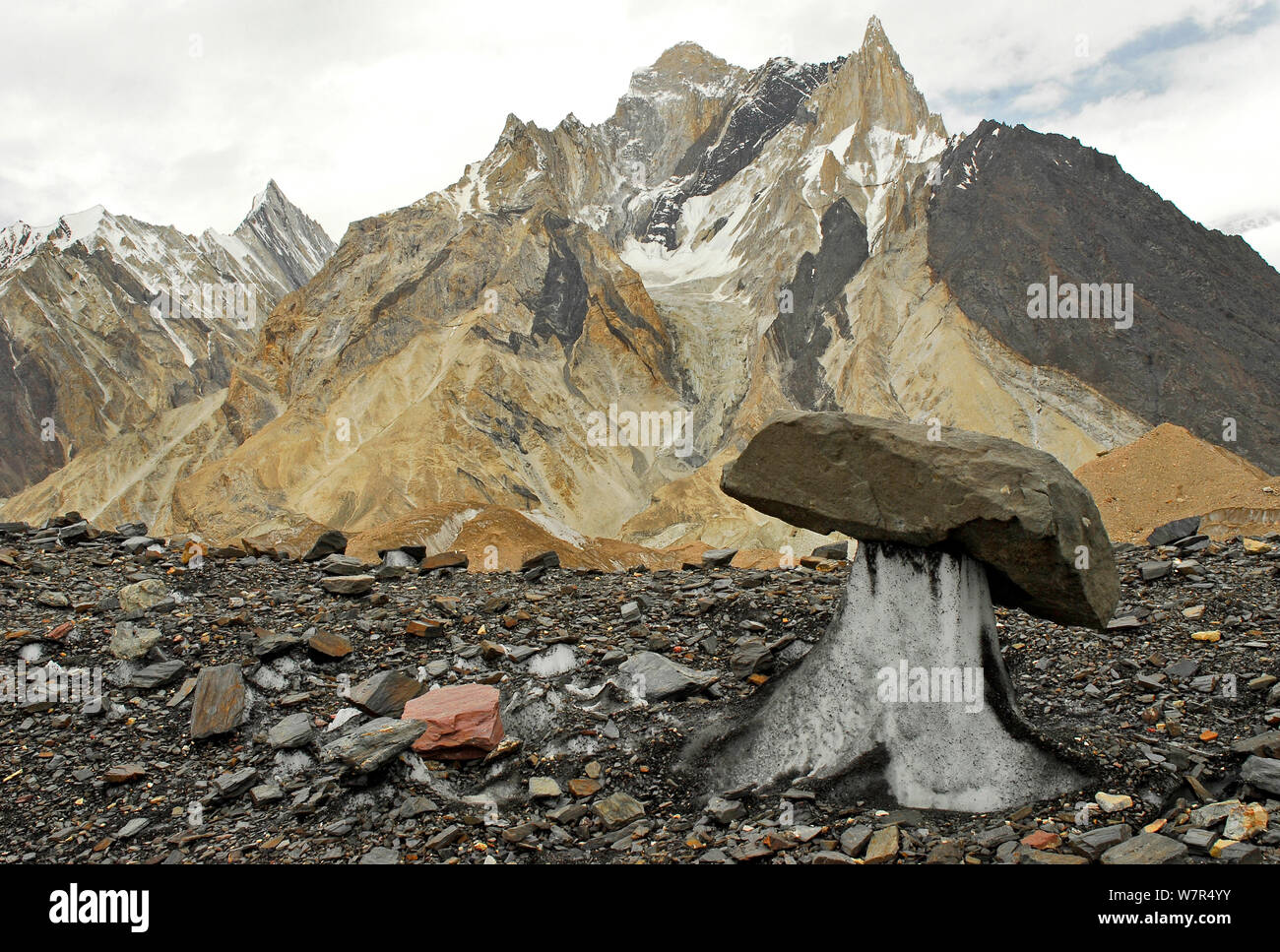 Rocks on the surface of the Baltoro Glacier, with mountains in the background, Central Karakoram National Park, Pakistan, June 2007. Stock Photo