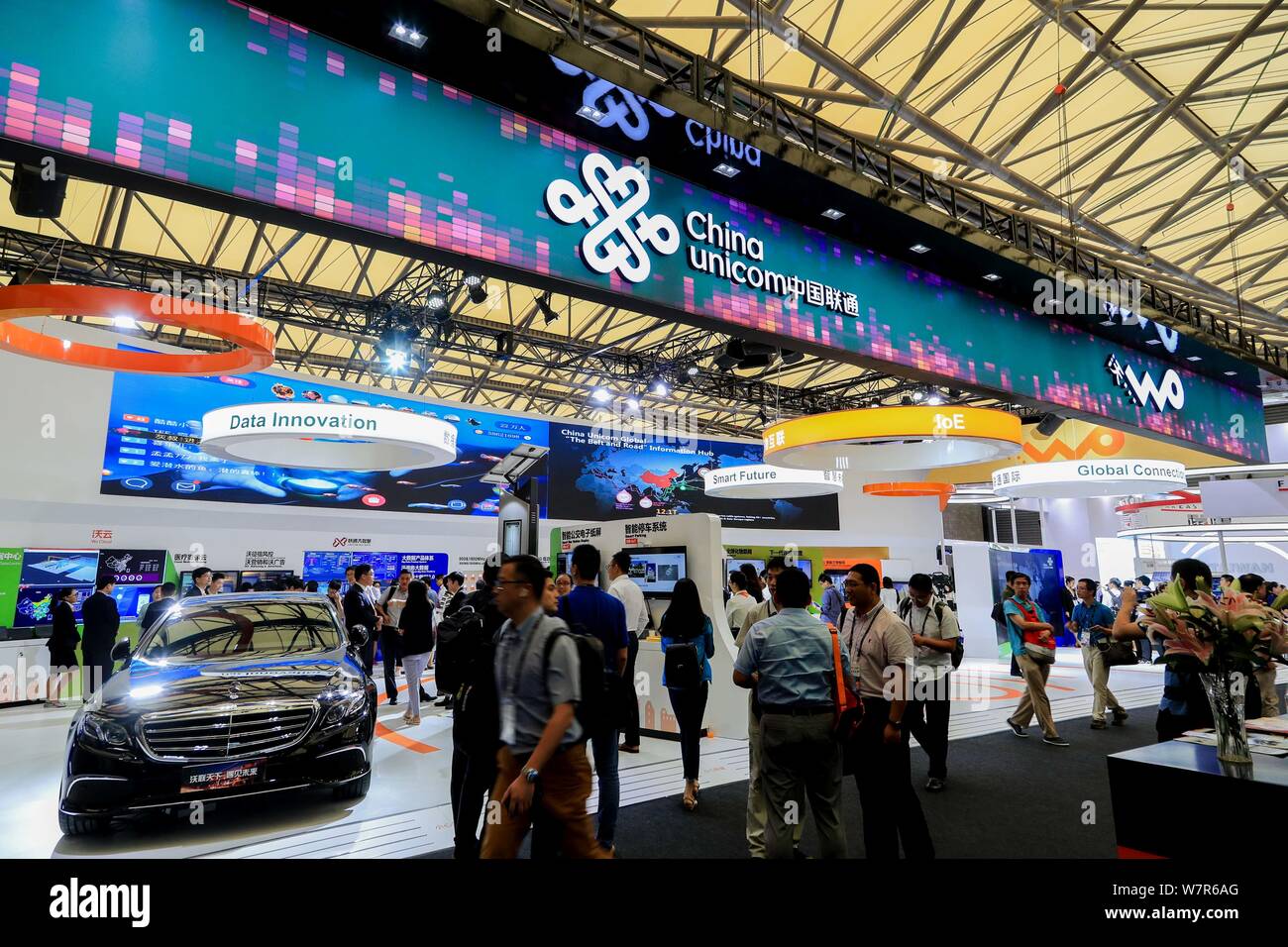 People visit the stand of China Unicom during the 2017 Mobile World Congress (MWC) in Shanghai, China, 28 June 2017.   The Mobile World Congress 2017 Stock Photo