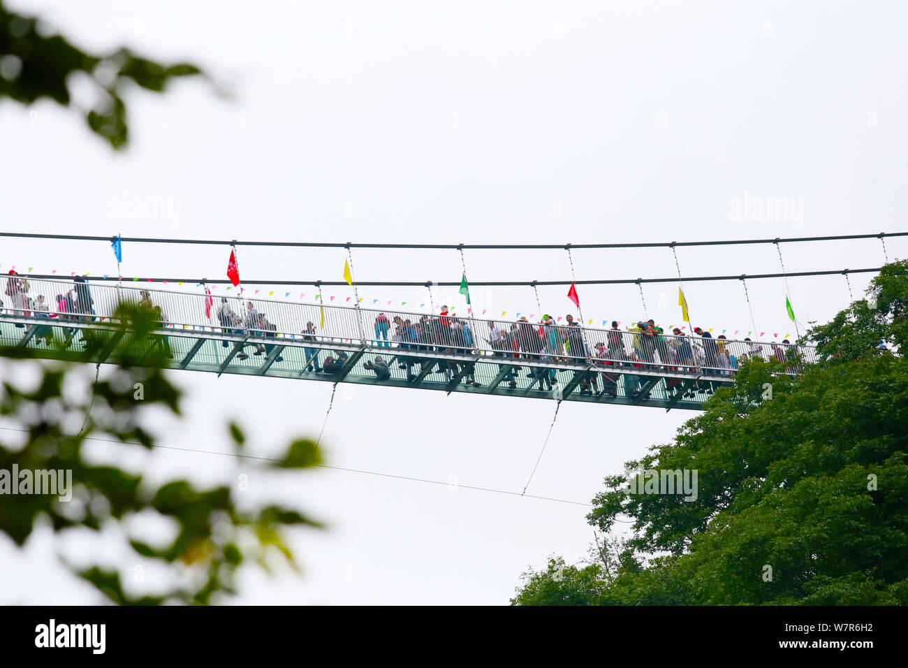 An worm's eye view of the glass bridge crowded with tourists at the Tianlongchi scenic area in Pingdingshan city, central China's Henan province, 11 J Stock Photo