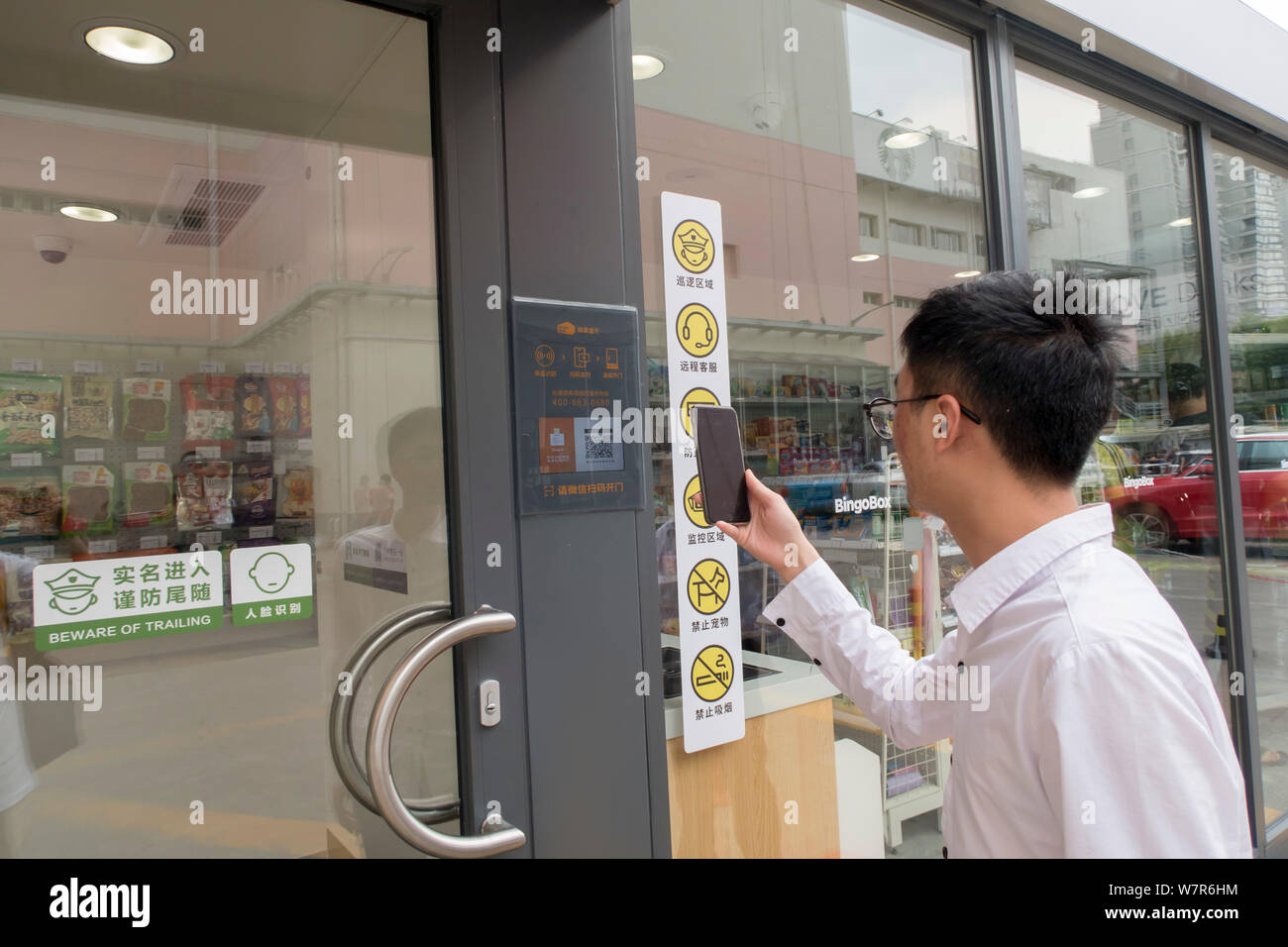 A customer uses his smartphone to scan a QR code on the door to enter the city's first BingoBox