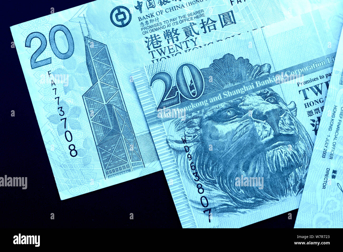 Different bills in twenty Hong Kong dollars close up. Money background blue  color toned Stock Photo - Alamy
