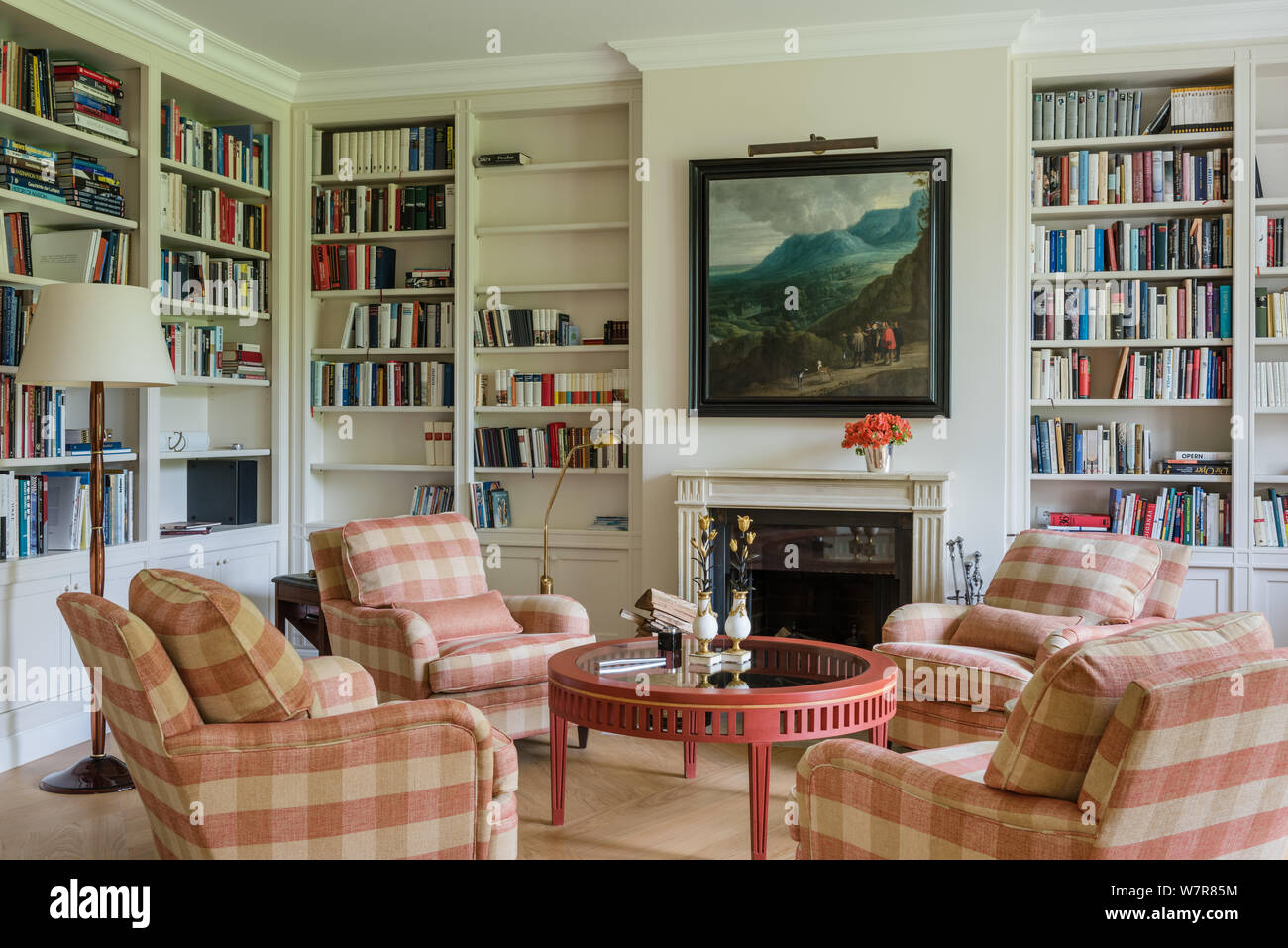 Country style living room with checked armchairs Stock Photo