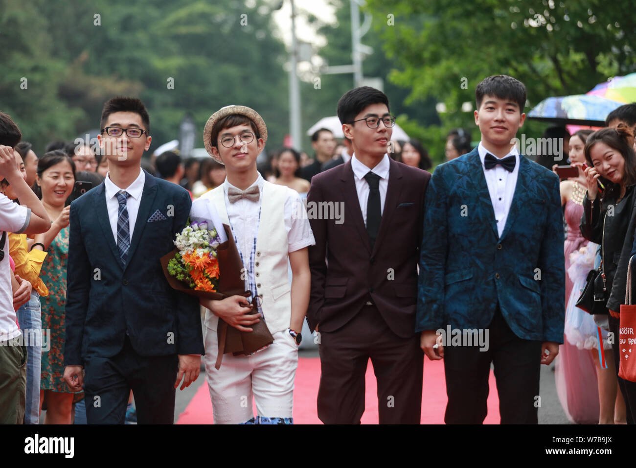 Students walk on the red carpet for a graduation party held by the Faculty of Science and Technology under the Communication University of China in Be Stock Photo