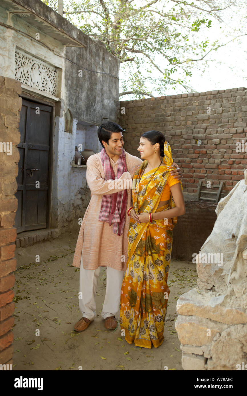 Rural couple standing together at home Stock Photo - Alamy