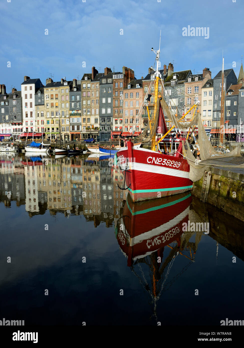 Honfleur harbour with fishing boat, France, March 2013 Stock Photo