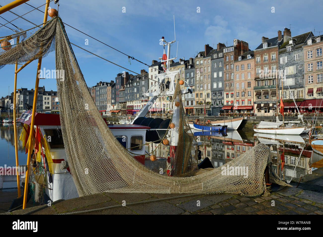 Honfleur harbour with fishing boat, France, March 2013 Stock Photo