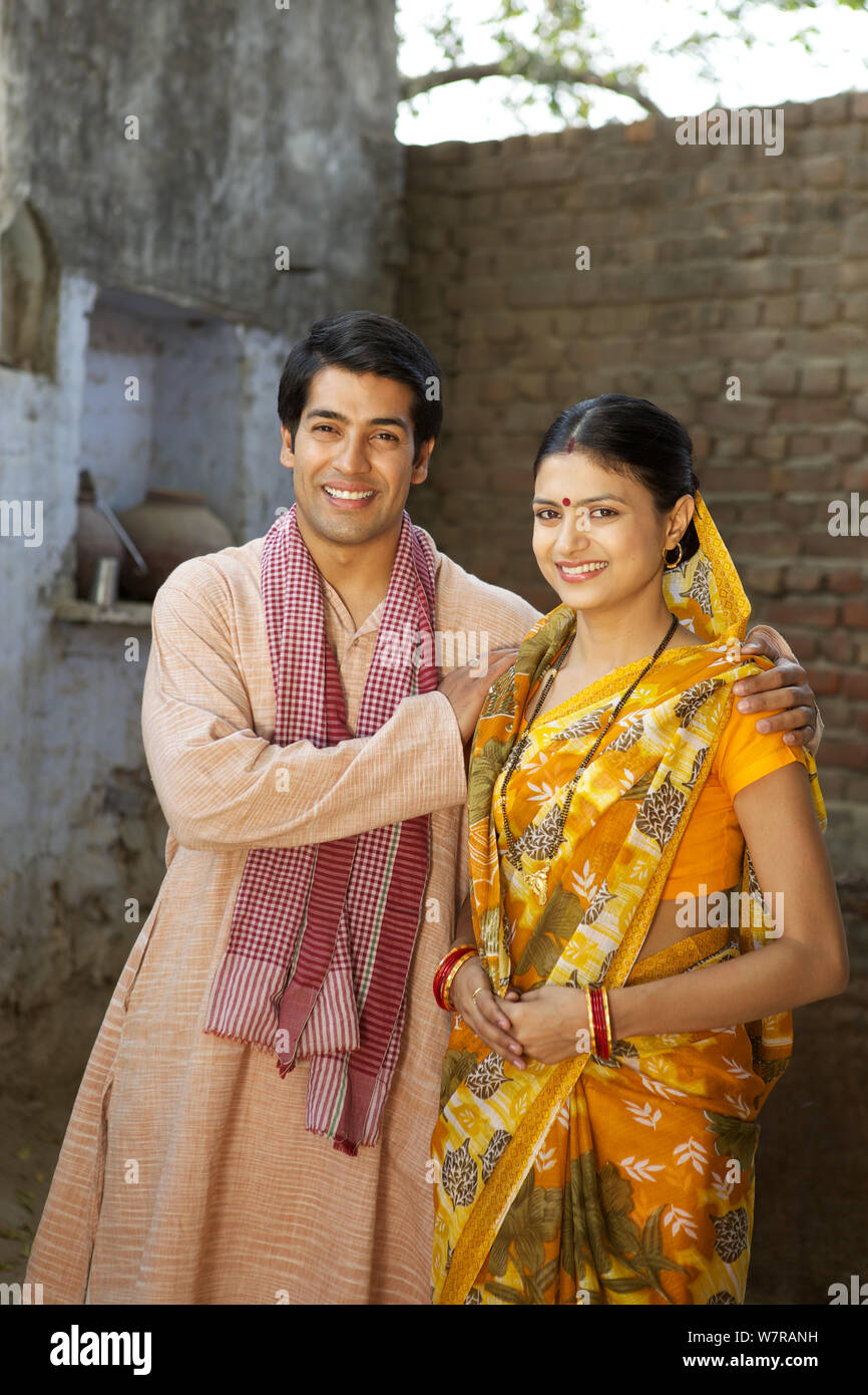 Rural couple standing together at home Stock Photo - Alamy