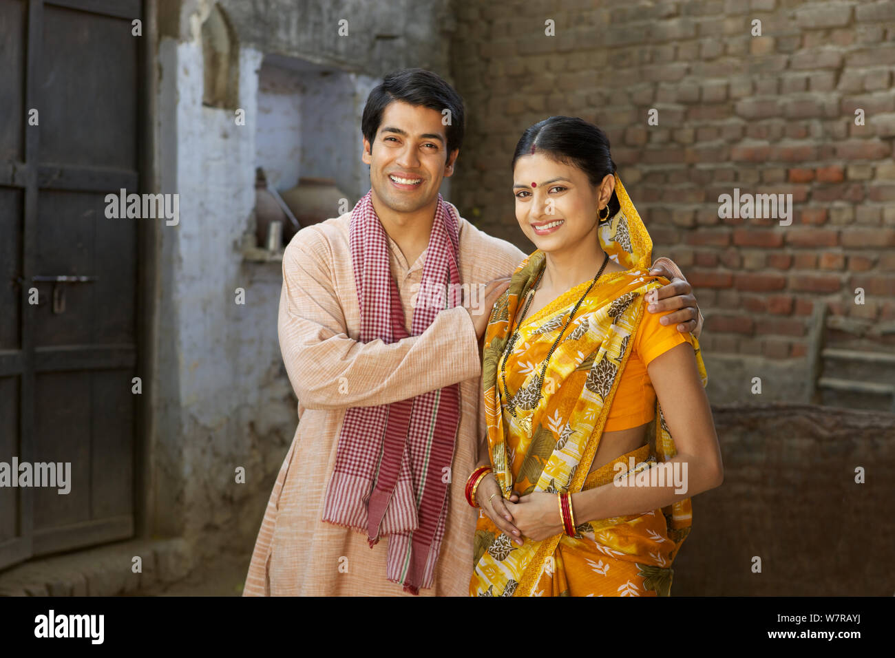 Rural couple standing together at home Stock Photo - Alamy
