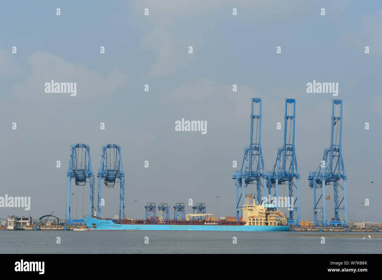 Shipping terminal with large freight ship, Pulicat Lake, Tamil Nadu, India, January 2013. Stock Photo