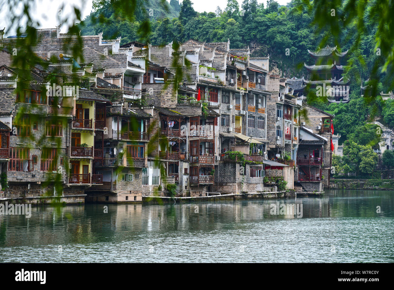 Old houses are seen along the Wuyang River in Zhenyuan ancient water town in Qiandongnan Miao and Dong Autonomous Prefecture, southwest China's Guizho Stock Photo