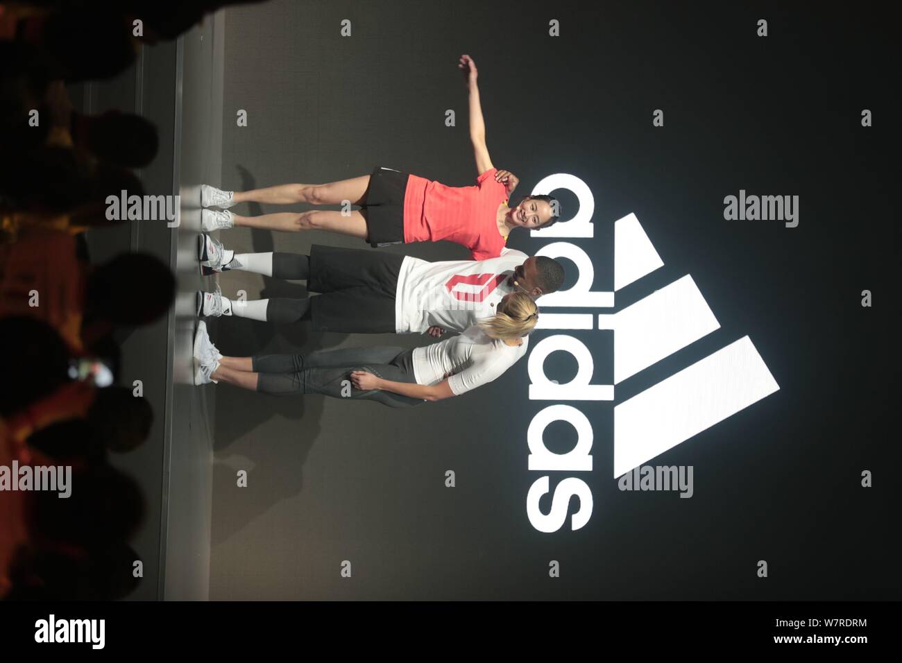 American basketball player Damian Lillard, center, American fashion model  and entrepreneur Karlie Kloss, right, attend a promotional event for adidas  Stock Photo - Alamy