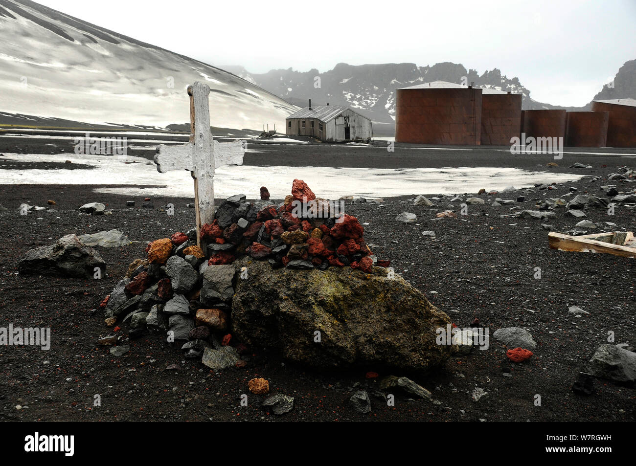 Grave covered with red rocks, near Old Whaling Station. Deception Island. Antarctica Stock Photo