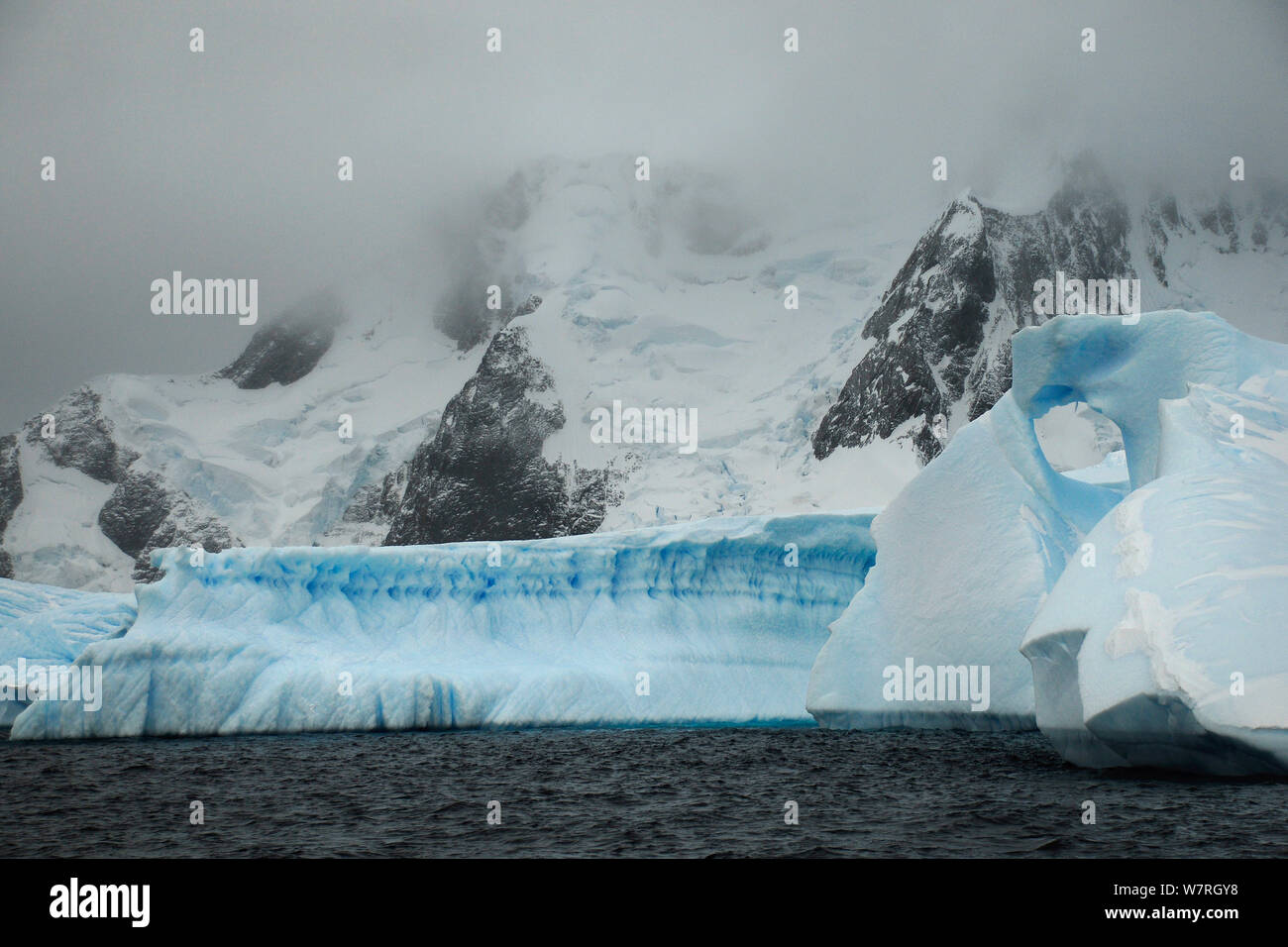 Blue iceberg in Iceberg Alley, Pleneau Island. Antarctica. Stock Photo
