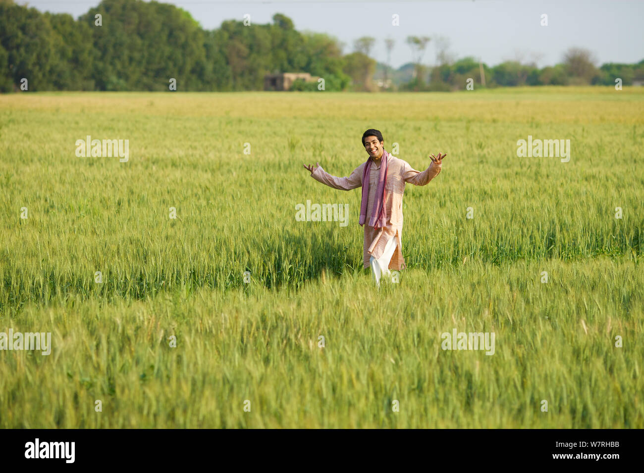 Farmer showing his field Stock Photo - Alamy
