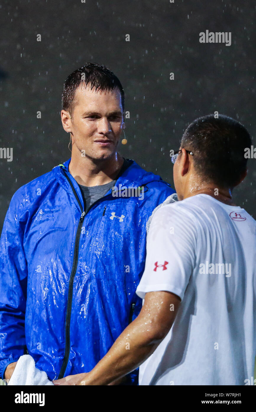 American football player Tom Brady for the New England Patriots of the National Football League (NFL) takes part in a football training camp in Shangh Stock Photo