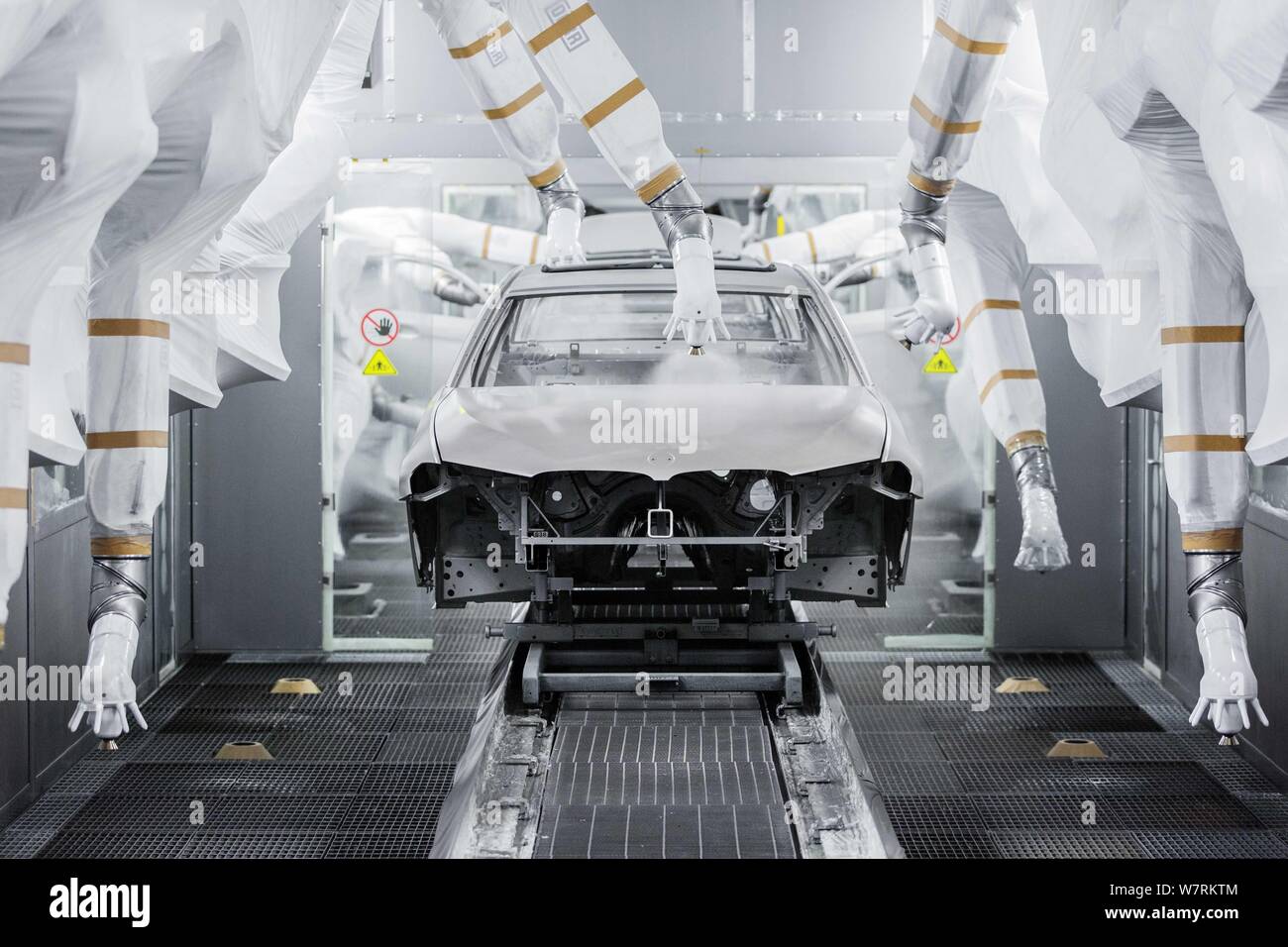 (190807) -- Beijing, Aug. 7, 2019 (Xinhua) -- Undated file photo shows industrial robotic arms paint a car at Dadong Plant of BMW Brilliance Automotive (BBA) in Shenyang, capital of northeast China's Liaoning Province. (Xinhua) Stock Photo