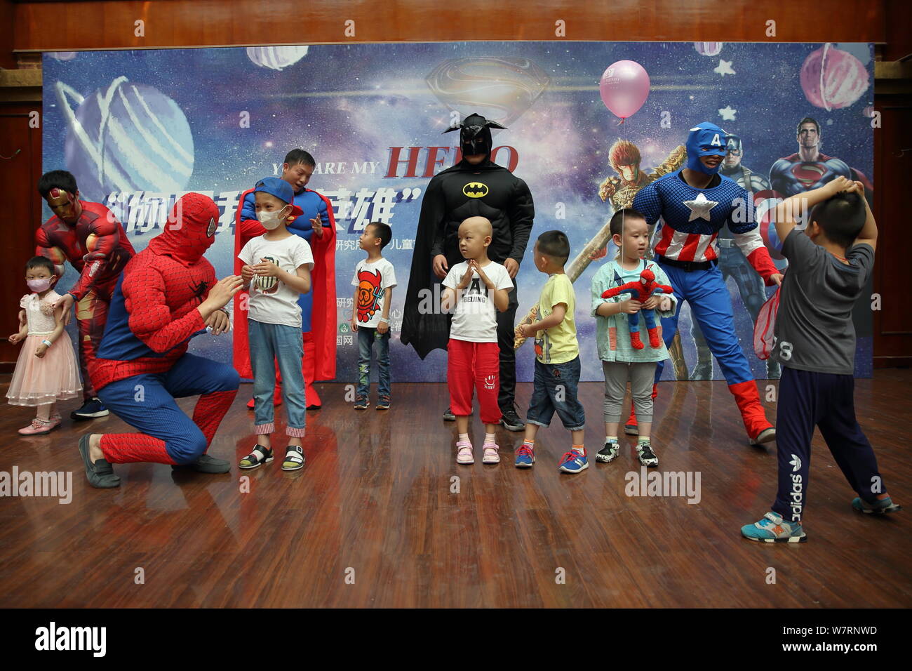 Chinese staff members dressed like Iron Man, Spiderman, Superman, Batman  and Captain America play with children at the Capital Institute of  Pediatrics Stock Photo - Alamy