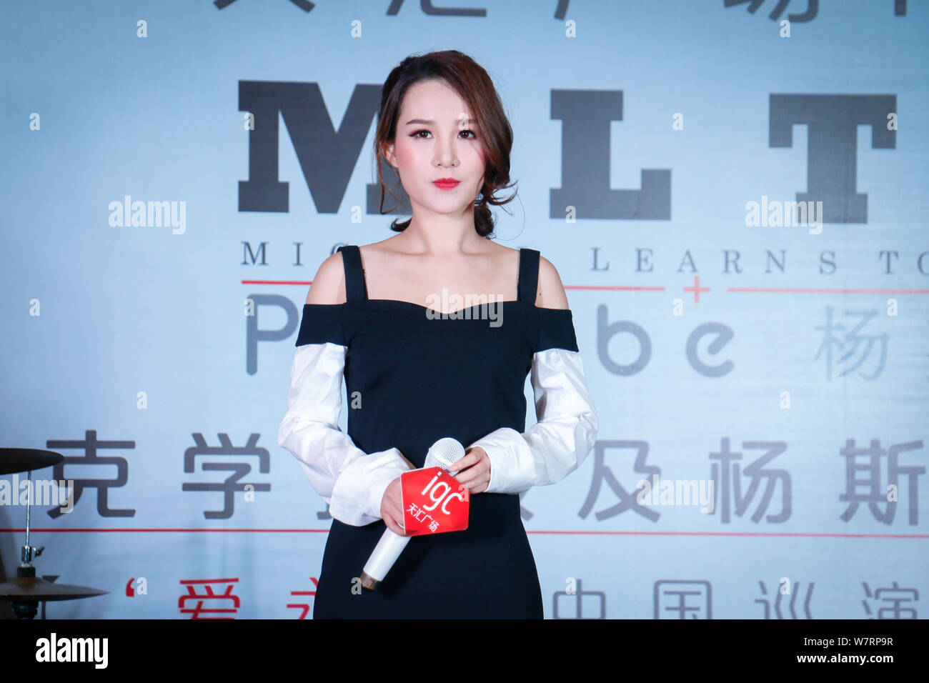 Chinese singer Phoebe Yang or Yang Sijie attends a press conference to promote the China concert tour of Danish rock band Michael Learns to Rock (MLTR Stock Photo