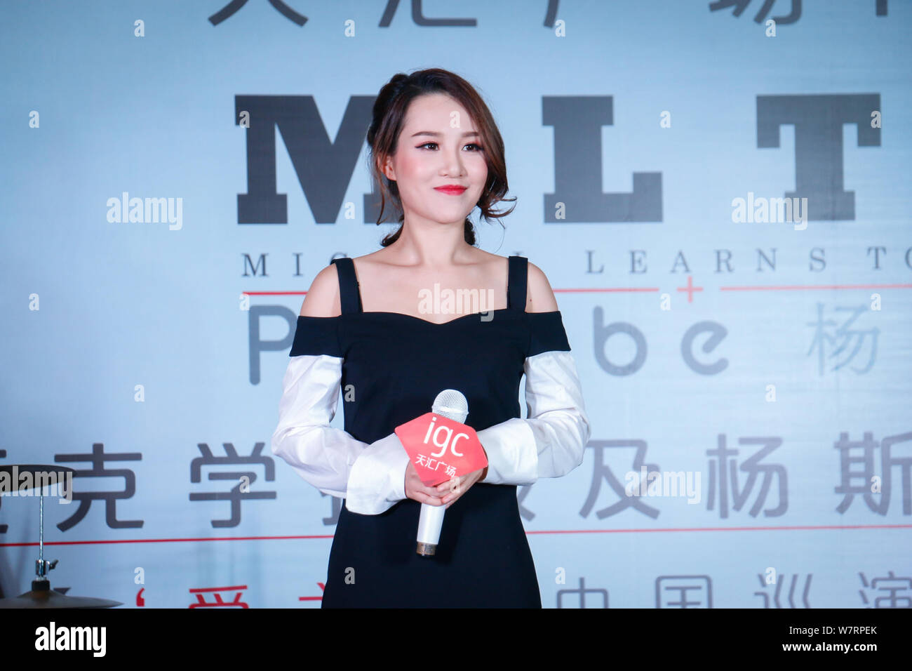 Chinese singer Phoebe Yang or Yang Sijie attends a press conference to promote the China concert tour of Danish rock band Michael Learns to Rock (MLTR Stock Photo