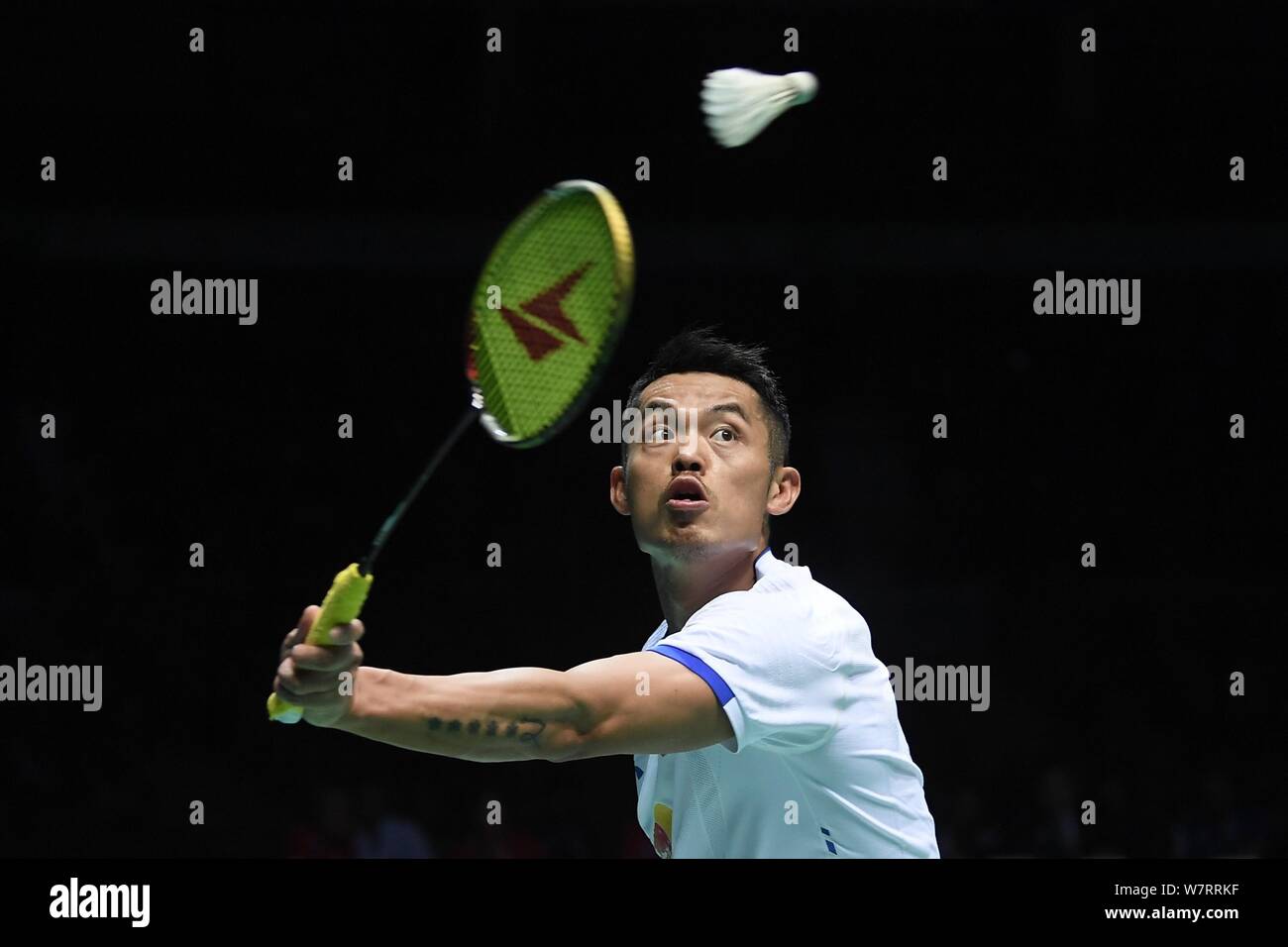 Lin Dan of China returns a shot to Lee Chong Wei of Malaysia in their semifinal match of the men's singles during the 2017 Badminton Asia Championship Stock Photo