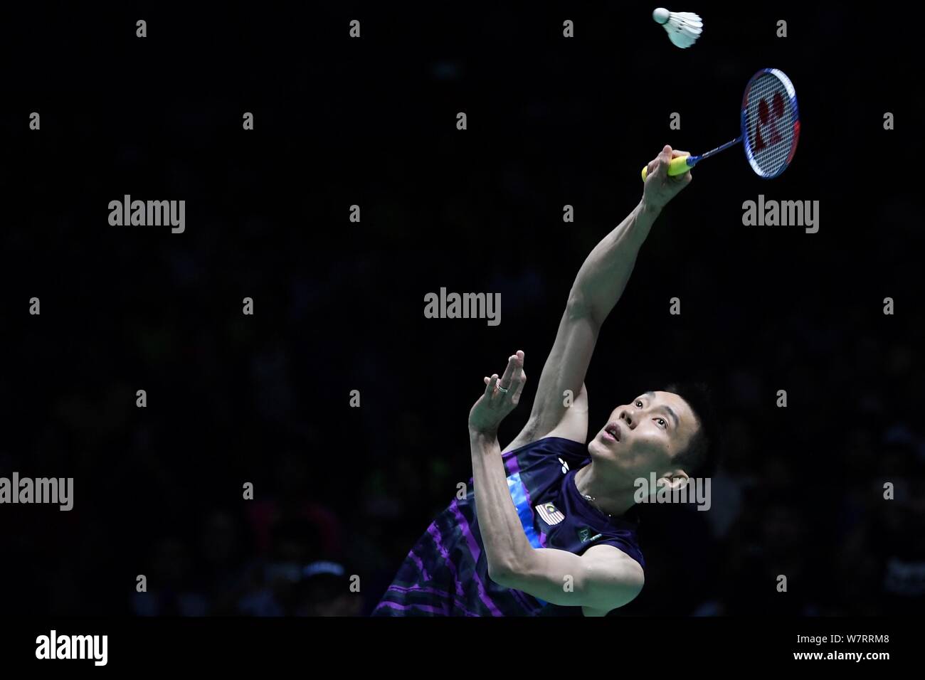 Lee Chong Wei of Malaysia returns a shot to Lin Dan of China in their semifinal match of the men's singles during the 2017 Badminton Asia Championship Stock Photo