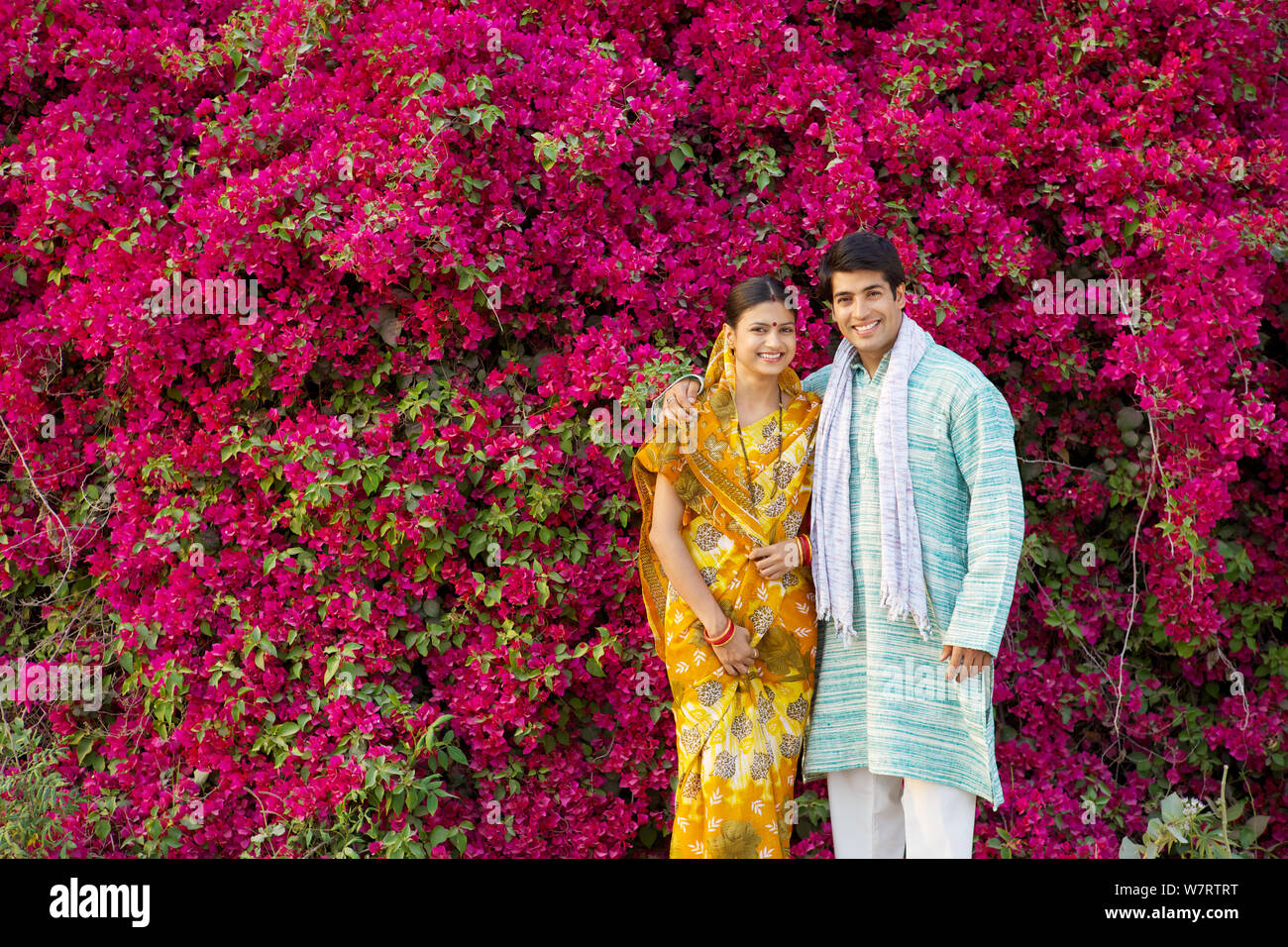 Rural couple standing together in a park Stock Photo - Alamy