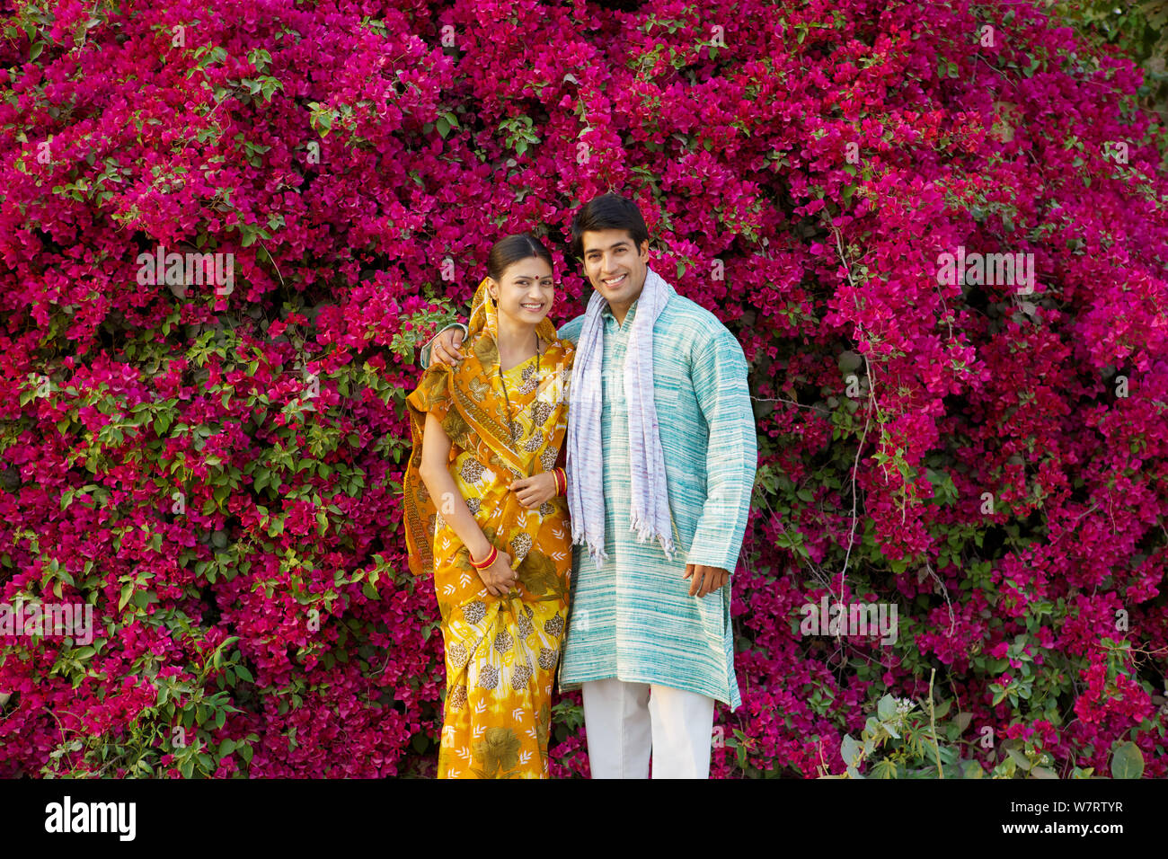 Rural couple standing together in a park Stock Photo - Alamy
