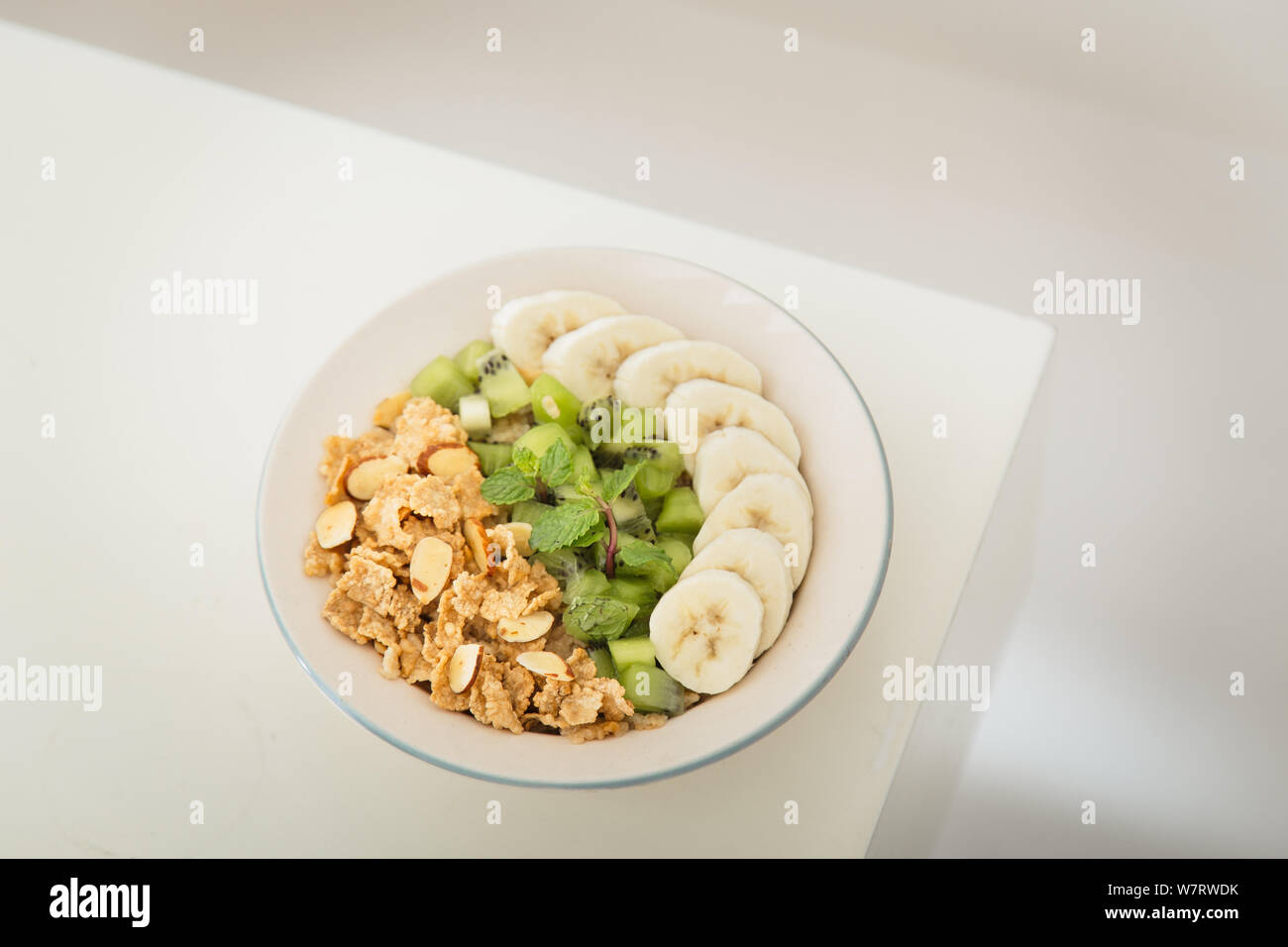 Healthy breakfast with high fibre bran flakes, kiwi and banana Stock Photo Alamy