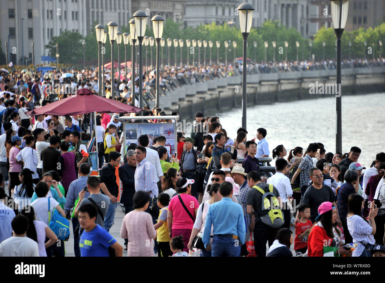 Tourists crowd the promenade on the Bund along Huangpu River during the Labor Day holiday in Shanghai, China, 30 April 2017.   China saw a tourism boo Stock Photo