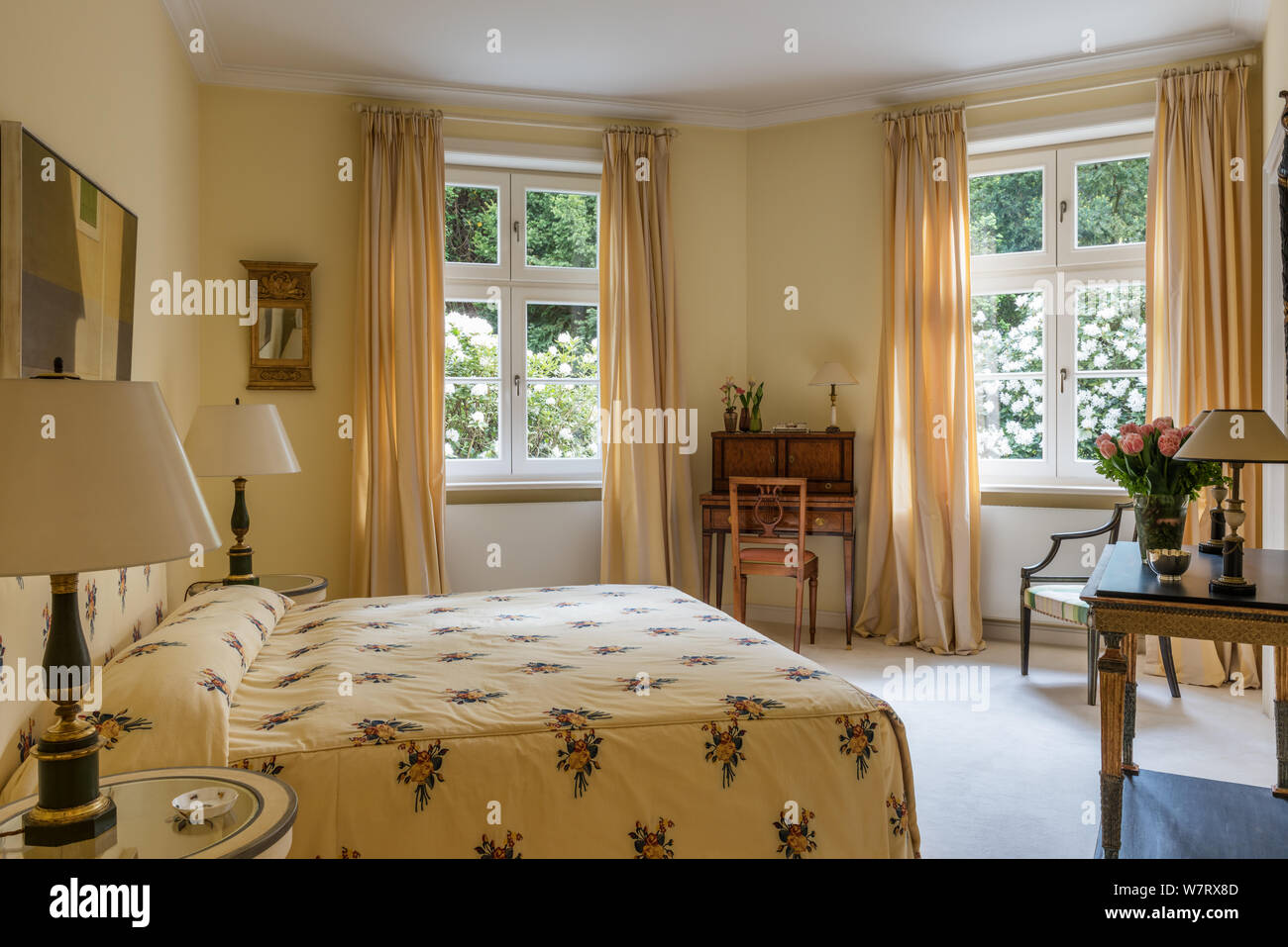 Pastel yellow toned bedroom Stock Photo - Alamy