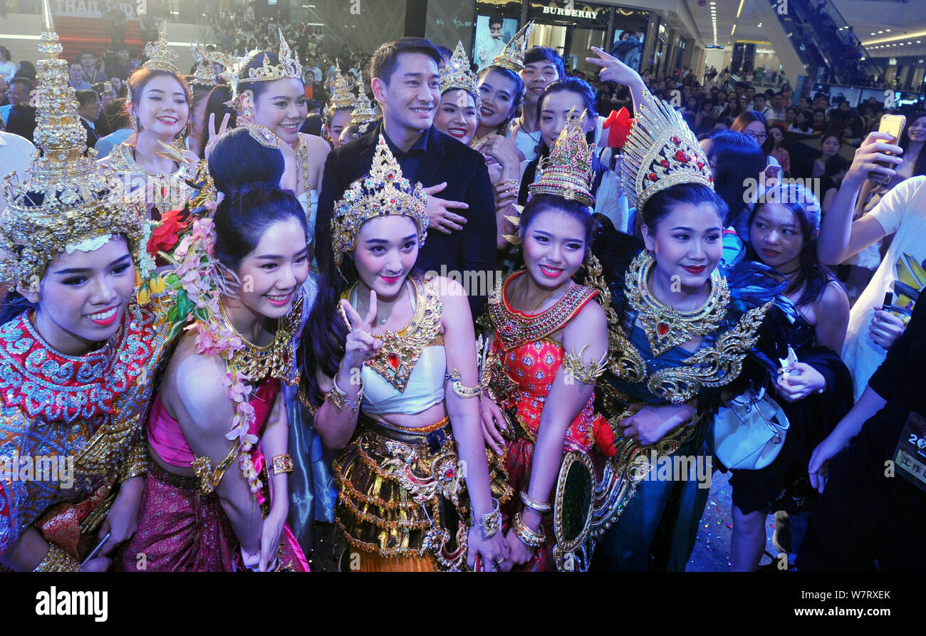 Thai actor Nawat Kulrattanarak, center, better known by his stage name
