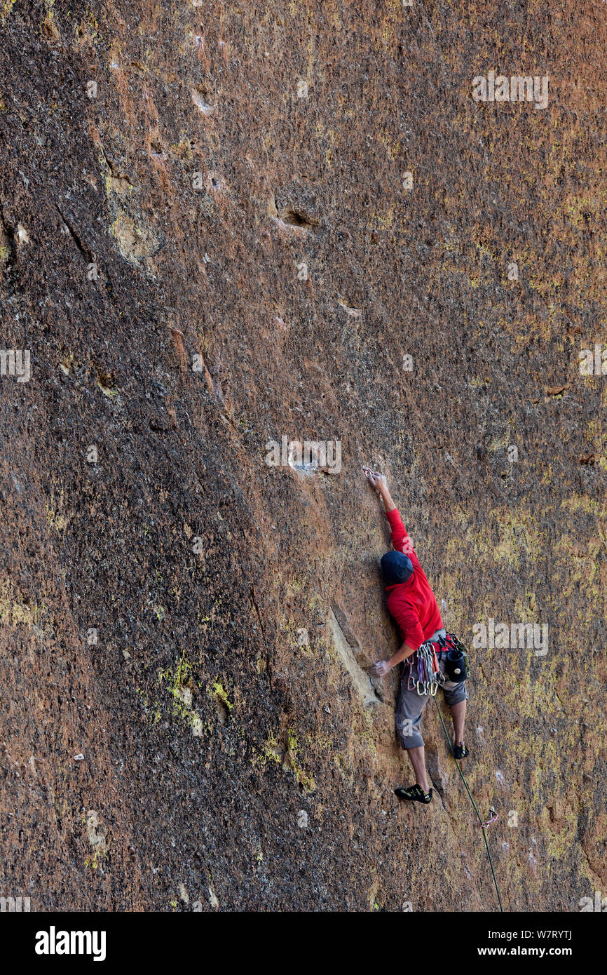 Man climbing the Screaming Yellow Zonkers route in Smith Rocks State Park, Oregon, May 2013. Model released. Stock Photo