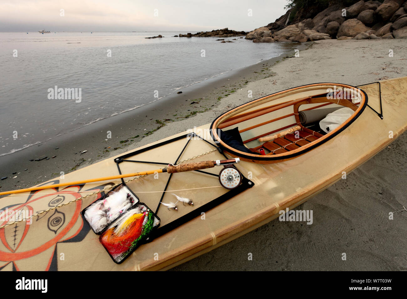Fly fishing gear and kayak along the shore of the Strait of Juan de